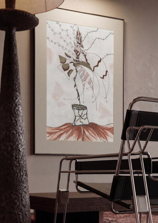 Earth Fairy by A Sleepy Spirit Art framed in a dim room beside a tubular steel chair