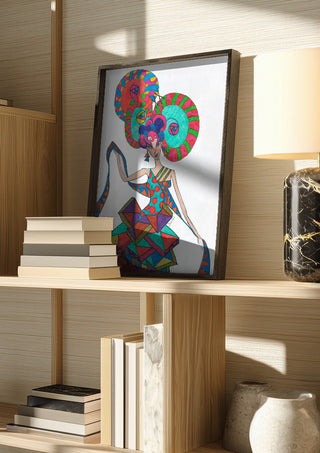 Life is geometry by A Sleepy Spirit Art in a dark frame on a wooden shelf beside books and a lamp