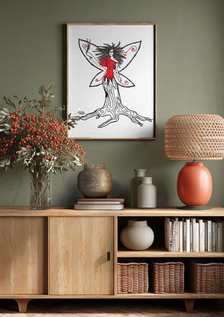 Freedom fairy by A Sleepy Spirit Art above a wooden sideboard on a sage green wall