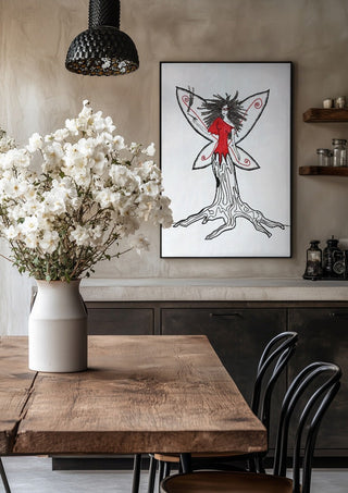 Freedom fairy by A Sleepy Spirit Art in a black frame above a rustic table with white flowers