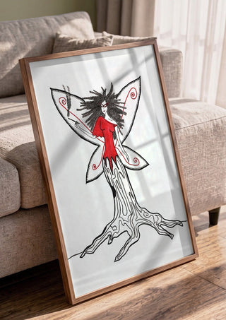 Freedom fairy by A Sleepy Spirit Art in a walnut frame leaning against a grey sofa