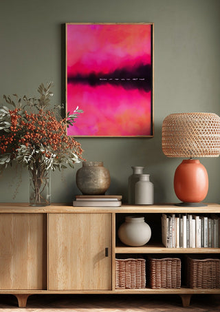 Never let them know your next move by Astrid Lind above a wooden sideboard on a sage green wall