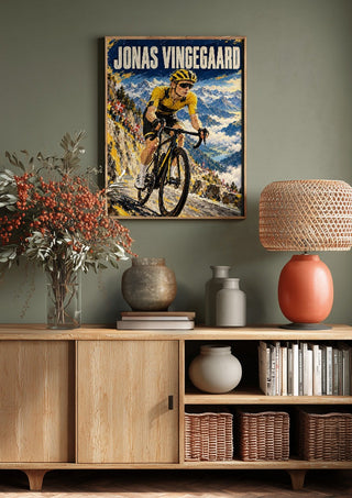 Jonas Vingegaard by Danii Steinfeldt above a wooden sideboard on a sage green wall