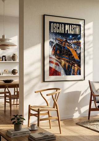 Oscar Piastri by Danii Steinfeldt in a black frame in a bright dining room with wooden chairs