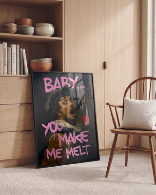 Framed Untitled - Dikhotomy artwork leaning against a cabinet, featuring bold pink text and a classic painting.