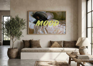 Framed "Woman In Repose" artwork by Talitha McQueen above a neutral-toned sofa in a modern living room.