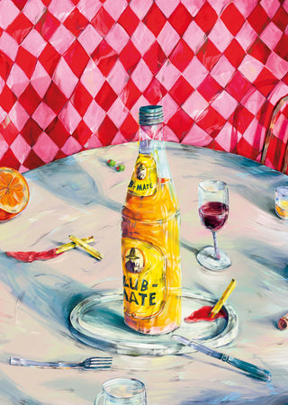 Vibrant Table Still Life by Natascha Baumgärtner – yellow soda bottle, red wine and orange on a café table