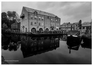 Canal Wharf in Black and White by Northern Gnome Photography - black-and-white stone mill and narrowboats reflected in a canal