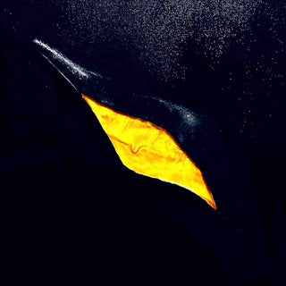 The golden crack by Marcel Herrmann - a glowing gold rift running diagonally across a deep blue-black ground