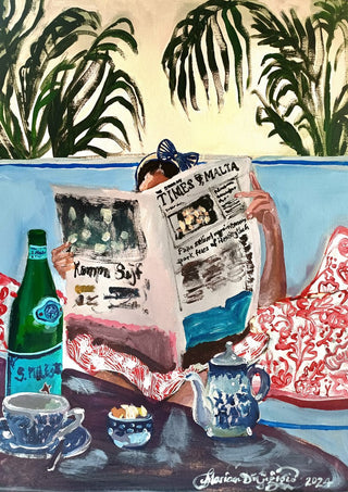 Sunday read at The Phoenicia, Malta by Mariam De Giorgio - a woman reading a newspaper on a blue banquette among palms