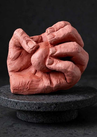 Hold Me - Terracotta Hands by Ammar - two clasped hands modelled in clay against black