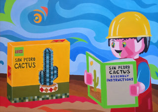 Psychotropic Bricks by Luigi Monti - a Lego figure reading instructions for a San Pedro cactus in a bright desert
