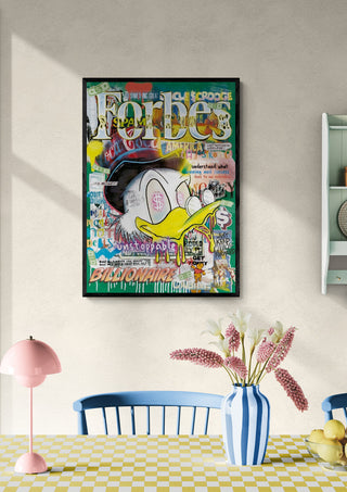 Forbes 2 - Ricardo Noble artwork featuring a colorful Donald Duck collage hangs above a dining table.