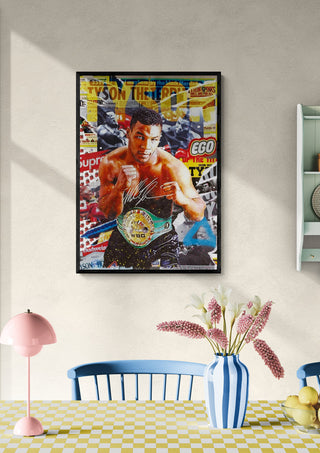 Framed Tyson - Ricardo Noble artwork hanging on a wall above a dining table with checkered tablecloth.