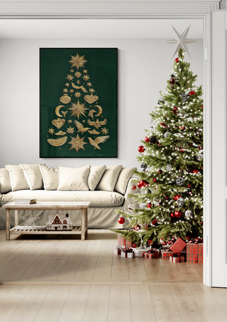 Decorated Christmas tree with green ornaments beside a sofa and festive wall art in a bright living room.