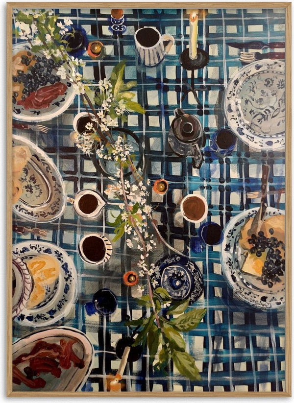 Easter Breakfast by Mariam De Giorgio - a blue and white checked table of cake, coffee and white blossom from above