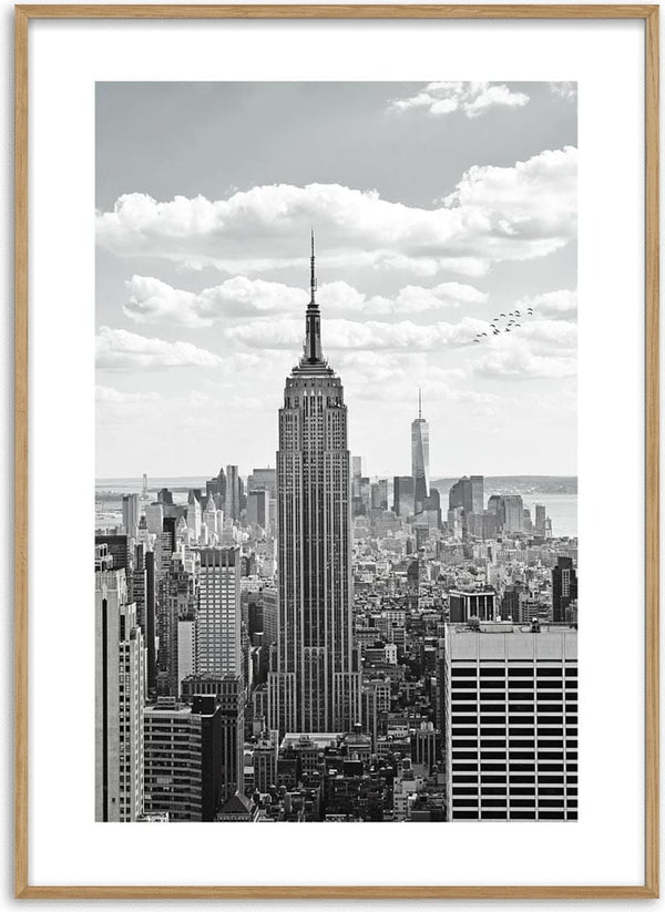 Black and white poster of the Empire State Building towering over the New York City skyline.