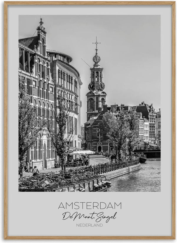 Black and white photo of De Munt tower by a canal in Amsterdam, featured on an In focus: AMSTERDAM product page.