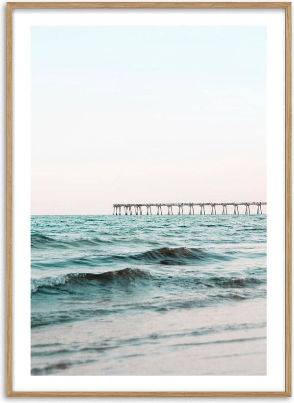 Long bridge extending over calm blue sea under a pastel sky, featured on the Long Bridge by the Sea Plakat.