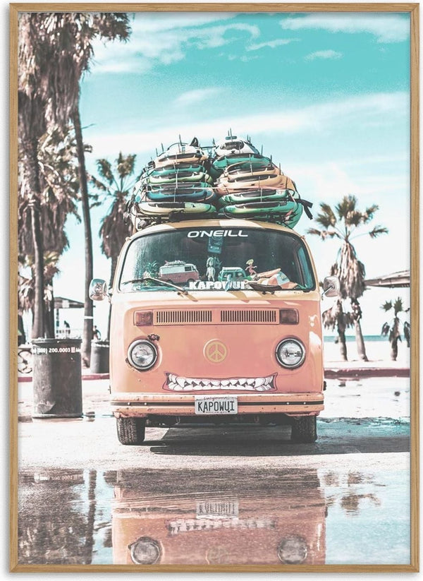 Orange van loaded with surfboards parked on a sunny beach, palm trees in the background.