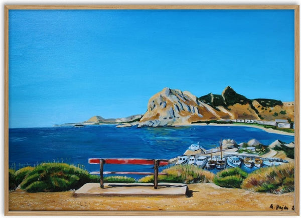 View towards Kolymbia by Nella Hajdu - red bench on a clifftop above a deep blue bay on Rhodes